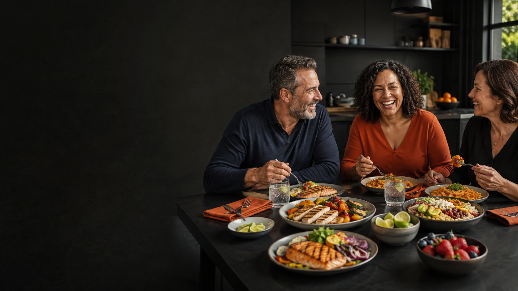 Three friends enjoying a vibrant, balanced dinner together at a table